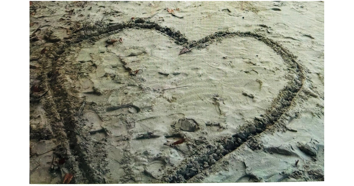 Heart in sand on beach