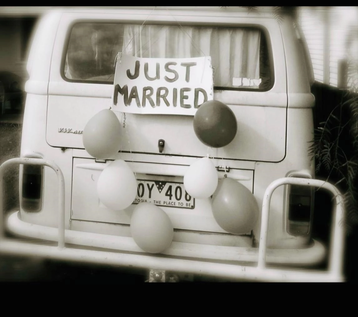 VW van with "just married" sign on back